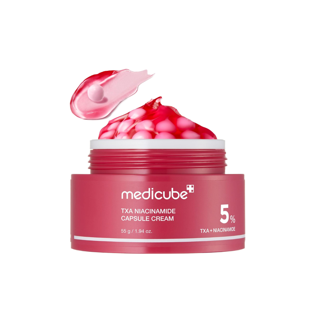 MEDICUBE TXA Niacinamide Capsule Cream is a brightening cream packed with 50,000ppm Niacinamide and Tranexamic Acid to help fade dark spots and improve uneven skin tone. Infused with Hyaluronic Acid, Ceramide NP, and Panthenol, it delivers deep hydration and strengthens the skin barrier, while Glutathione and Vitamin C derivatives enhance radiance. The lightweight capsules melt effortlessly into the skin, leaving it smooth and luminous.