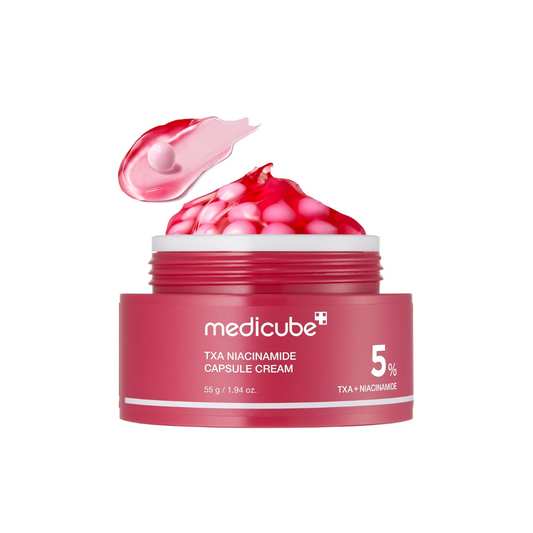 MEDICUBE TXA Niacinamide Capsule Cream is a brightening cream packed with 50,000ppm Niacinamide and Tranexamic Acid to help fade dark spots and improve uneven skin tone. Infused with Hyaluronic Acid, Ceramide NP, and Panthenol, it delivers deep hydration and strengthens the skin barrier, while Glutathione and Vitamin C derivatives enhance radiance. The lightweight capsules melt effortlessly into the skin, leaving it smooth and luminous.