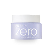Load image into Gallery viewer, BANILA CO Clean It Zero Cleansing Balm Purifying is a gentle, sorbet-like balm that melts into a silky oil to effortlessly remove makeup, sunscreen, and impurities. Formulated with Centella Asiatica, Licorice Root Extract, and Evening Primrose Oil, it soothes sensitive skin while cleansing deeply. Enriched with a blend of botanical extracts, this balm leaves skin soft, clean, and refreshed—without stripping moisture.&nbsp;